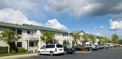 Exterior of Vineville Tower with parking area.