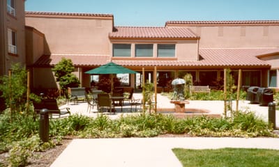 Outdoor space with tables and landscaping