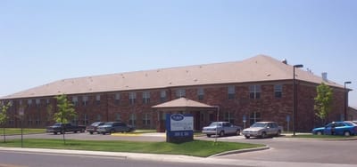 Exterior view of Vineville Tower building with parking.