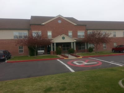 Exterior view of the facility with parking area