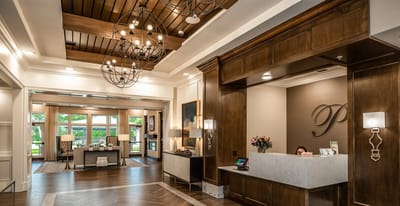 Lobby area with reception desk and lounge seating.