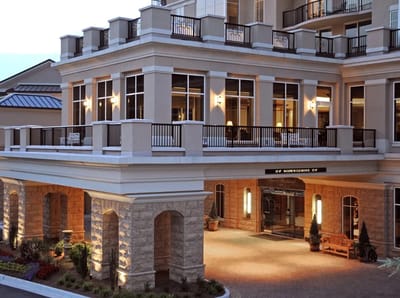 Elegant exterior entrance of a senior living facility.