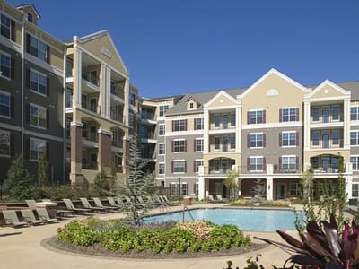 Exterior view of the facility with a pool area