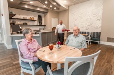 Residents enjoying a meal in the dining area.