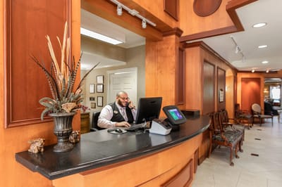 Reception area with staff member at the desk