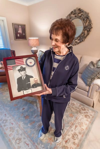 Resident showing a framed photo.