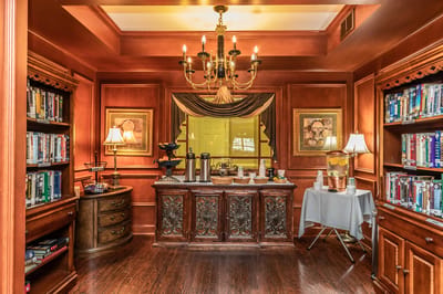 Interior library area with bookshelves and decor