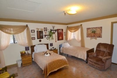 A cozy shared bedroom with two beds and decor