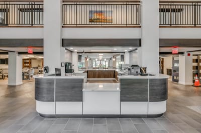View of the front desk area in a bright lobby
