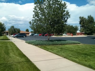 Parking area and landscaped pathway at the facility