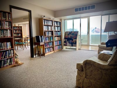 A common area with bookshelves and seating