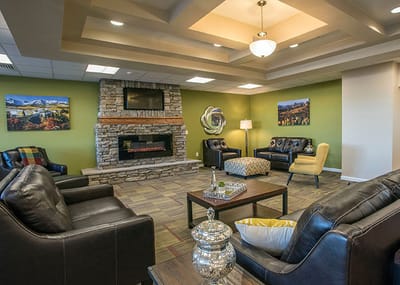 Comfortable common area with seating and fireplace