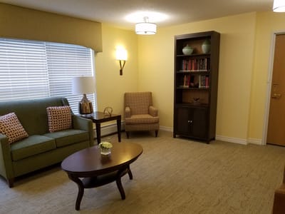 Cozy interior living space with seating and bookshelves