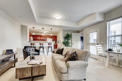 Bright common area with seating and kitchenette