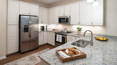Modern kitchen with food and drinks on a counter