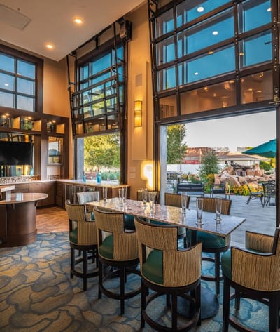 Inviting dining area with large windows and outdoor view