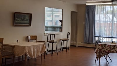 Empty common area with tables and chairs