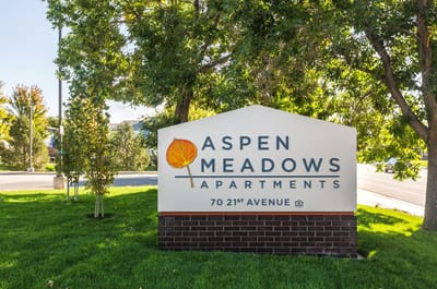 Outdoor sign of Aspen Meadows Apartments facility