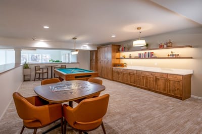 Bright common area with pool table and seating