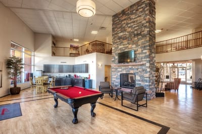 Common area with a pool table and seating