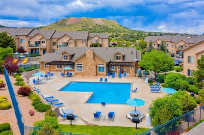 Aerial view of a pool area surrounded by apartments