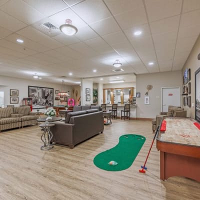 Common area with seating and mini-golf setup