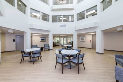 Bright common area with seating and tables