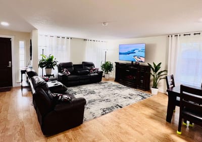 Bright common area with seating and television
