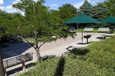 Outdoor space with benches and shade structures