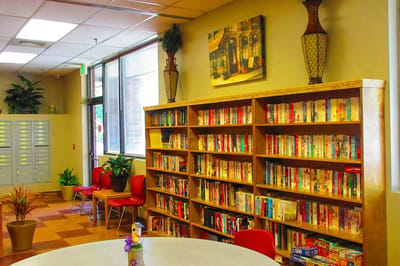 Common area with bookshelves and seating