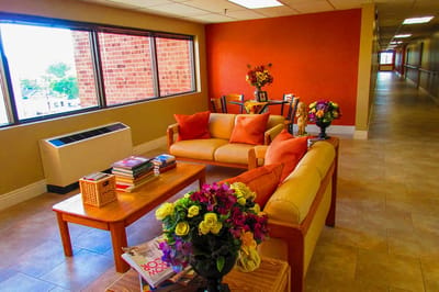 Cozy common area with seating and flowers