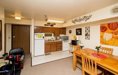 Cozy kitchen and dining area in a resident room