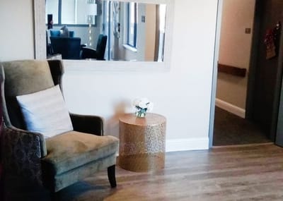 Interior lounge area with a chair and table
