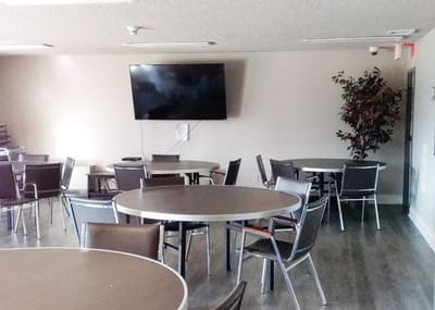 Interior dining area with round tables and chairs