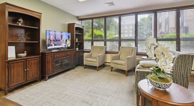 Bright common area with comfortable seating and natural light