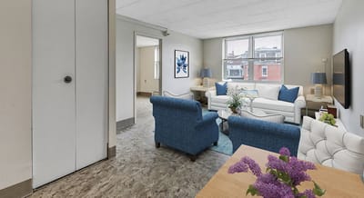 Bright and inviting interior living space with couches and artwork