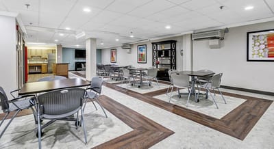 Interior view of a common area with tables and chairs