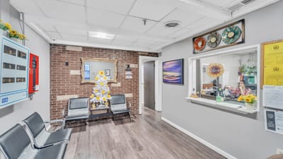 Inside view of a facility lobby with decorations and staff