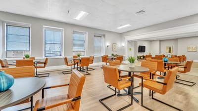 Common area with seating and tables in the facility