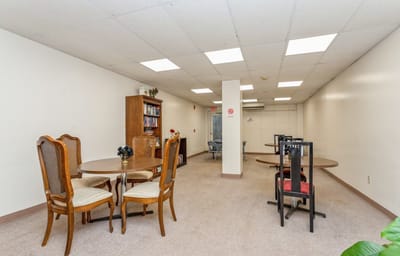 Empty common area with tables and chairs