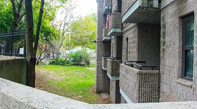 View of the facility building and surrounding green space