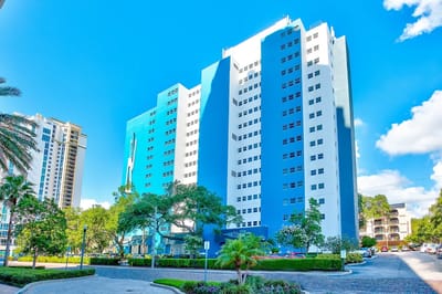 Exterior view of Presbyterian Towers building with landscaping.