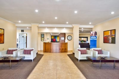Welcoming lobby area with seating and reception desk.