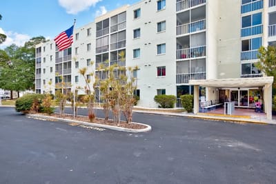 Exterior view of Presbyterian Towers with American flag