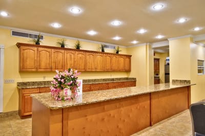Interior kitchen area with wooden cabinets and countertops