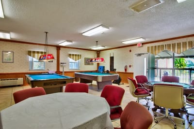 Common area with pool tables and seating