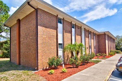 Exterior view of the building with landscaping.