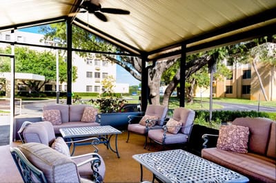 Outdoor seating area with tables and chairs