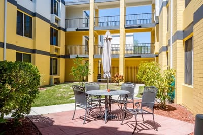 Outdoor seating area with tables and umbrellas