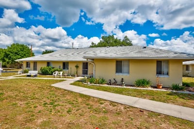 Exterior view of a residential building with garden area.